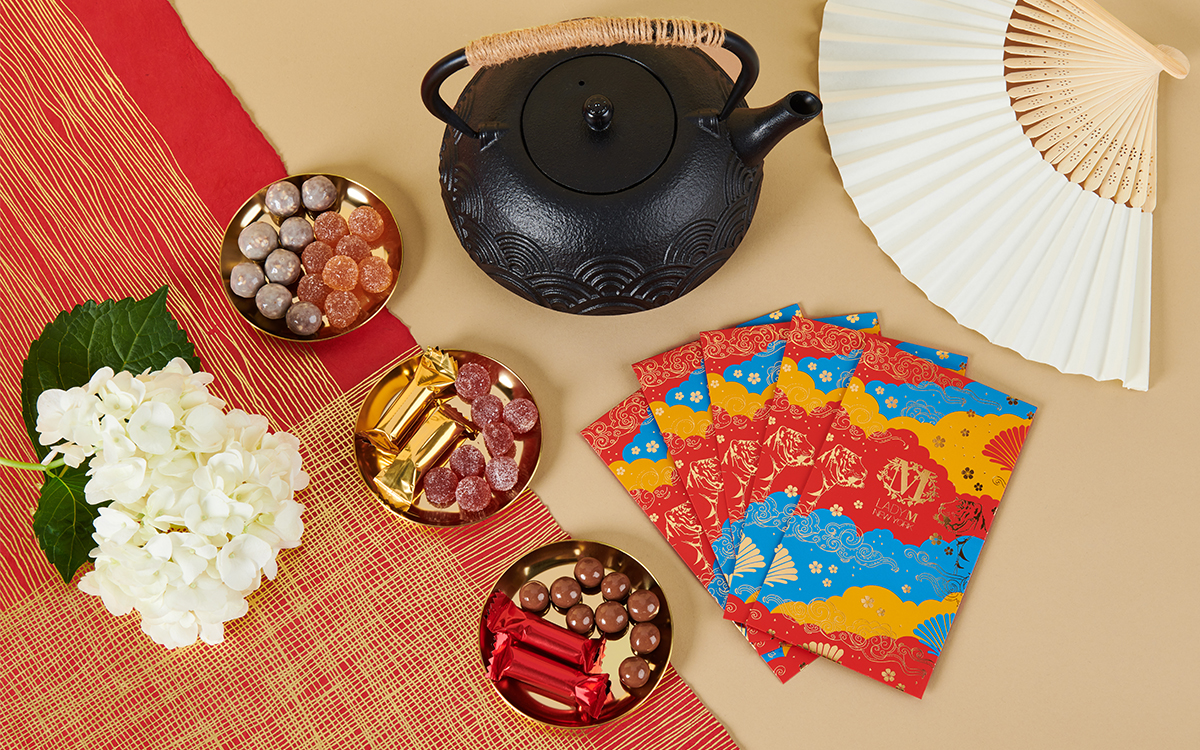 Premium Photo  Chinese new year and lunar new year celebrations with gold  bar giving red envelope and hot tea. the chinese word means : blessing,  happiness and lucky